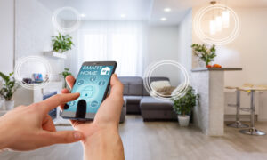 A hand holding a smartphone about to press a lock button in their home's living room. The phone reads "smart home".